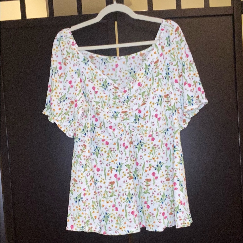 White top with small floral design